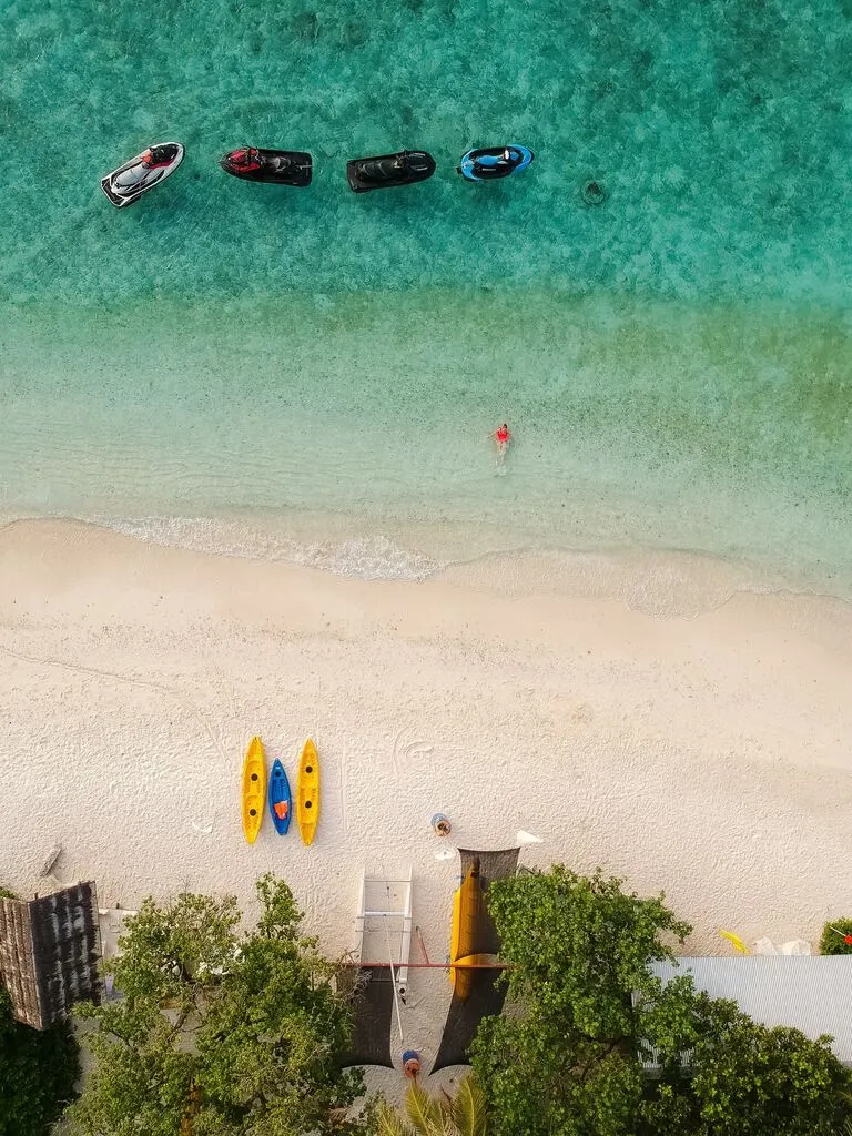 a group of boats on a beach