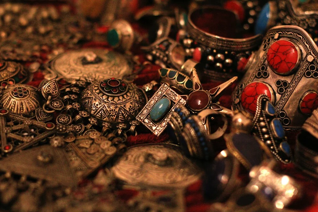 Chunky silver jewellry with colorful stones.