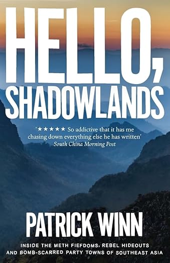 A book cover with mountains and text.