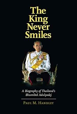 A book cover of a man sitting in a chair.