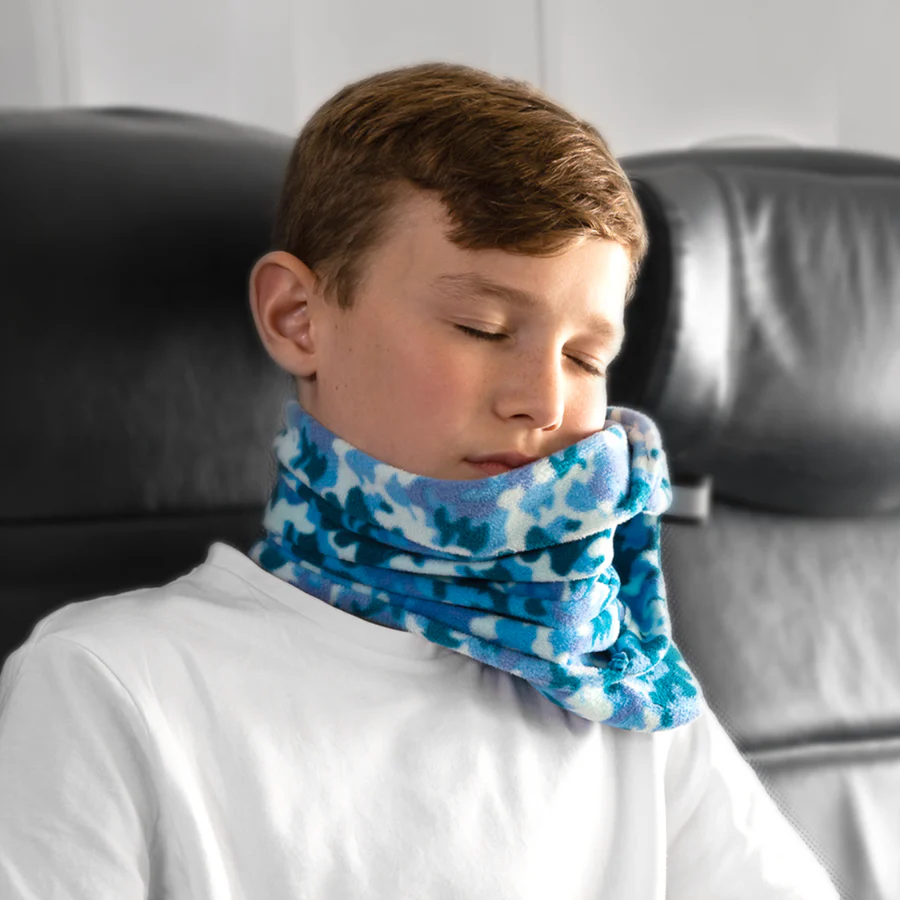 The 5 Best Travel Pillows for Kids in 2025 2 A boy with a scarf around his neck.