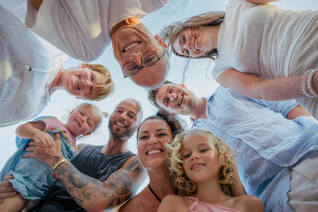 Big family looking down to the camera.