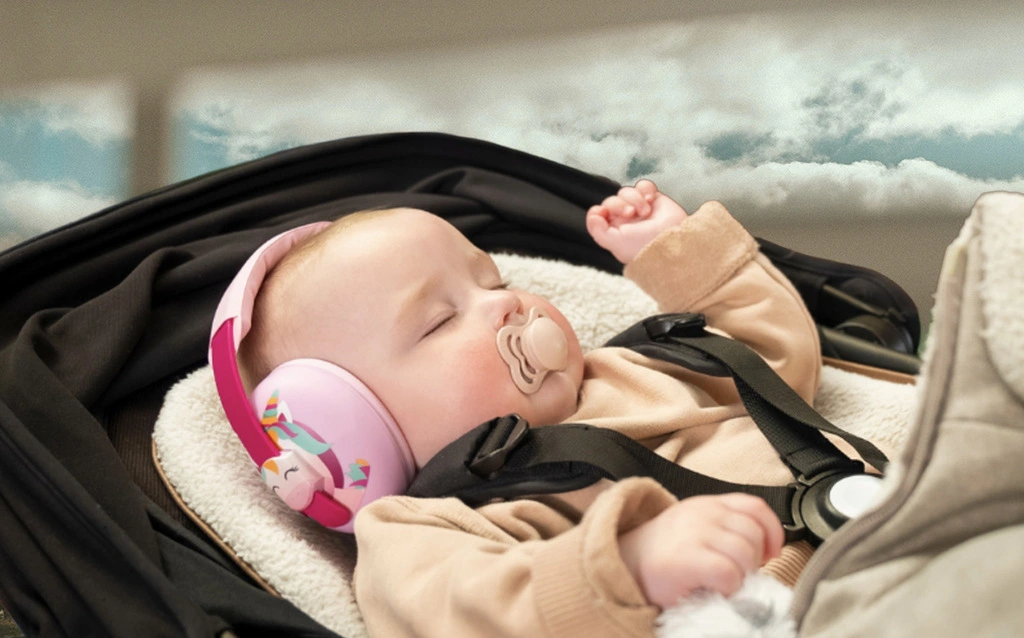 A baby sleeping in a stroller.