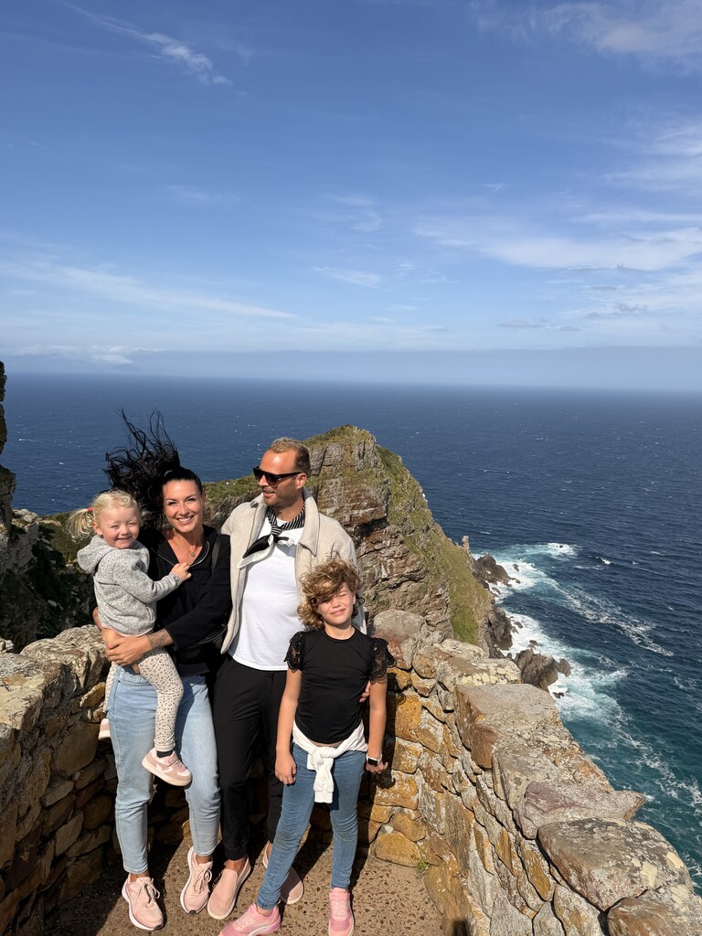 Cape of Good Hope Day Trip – Family Fun in South Africa 20 Family at scenic coastal viewpoint.