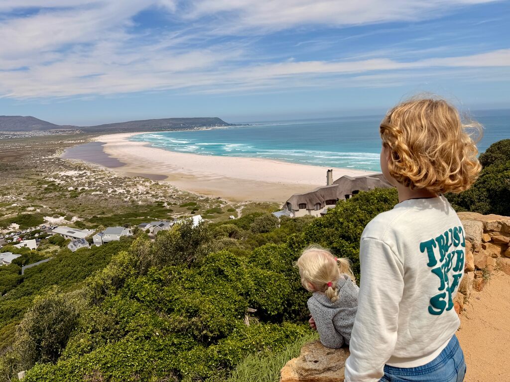 Two girls looking at a beach.