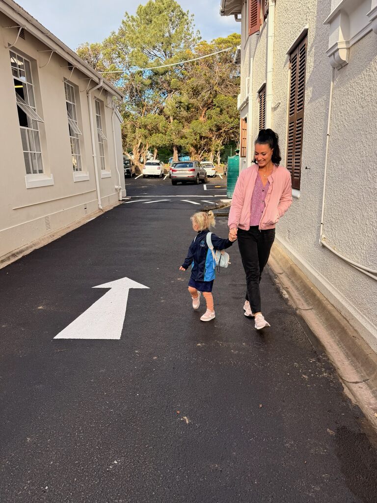 Living in Cape Town with Kids – What It’s Really Like 3 Woman walking with child on street.