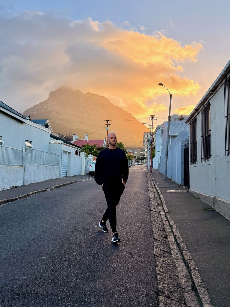 Person walking down a quiet street.
