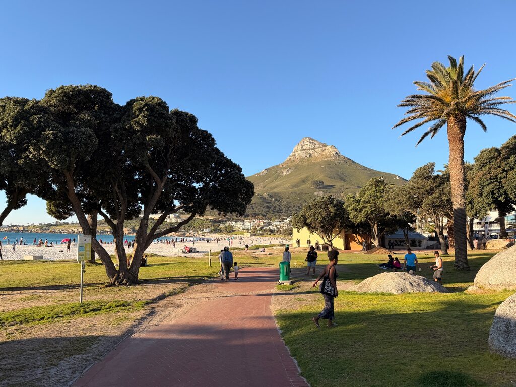 Beach scene with mountain backdrop.