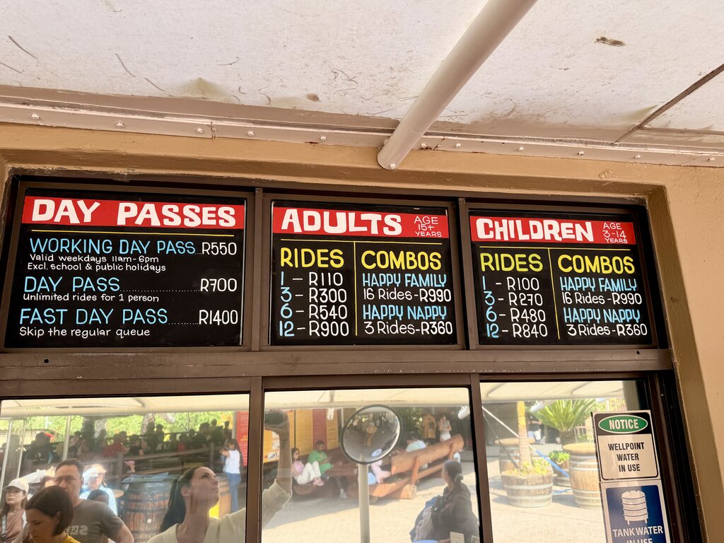 Toboggan Cape Town Fun: Our Day at Cool Runnings 4 Pricing board for amusement park passes.