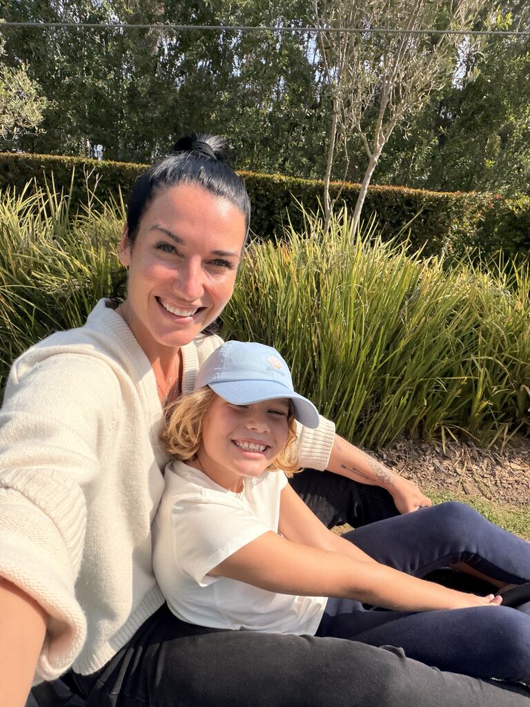 Toboggan Cape Town Fun: Our Day at Cool Runnings 1 Person and child sitting together outdoors.