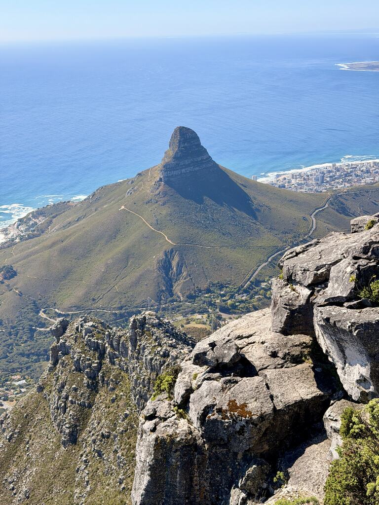 View from Table Mountain overlooking Lion&rsquo;s Head and the Atlantic Ocean on a sunny day in Cape Town, South Africa.