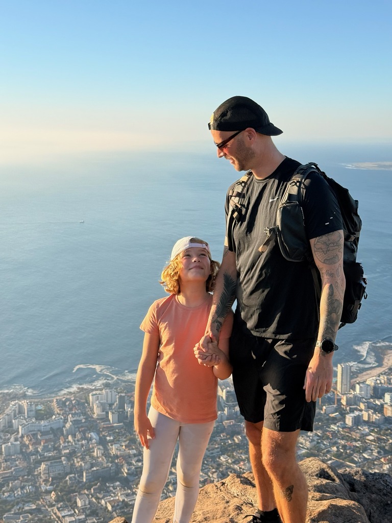 Lion's Head Hike with Kids – Is It Safe? Honest Family Guide 1 Father and child on mountain peak.
