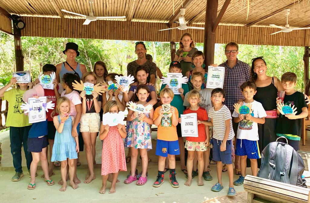 Group of children and adults celebrating.