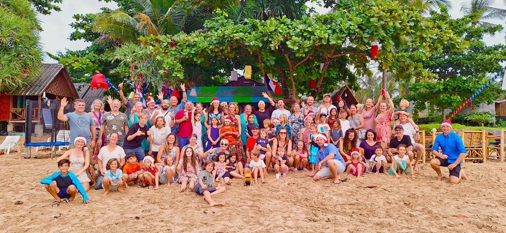 Group of families on the beach.