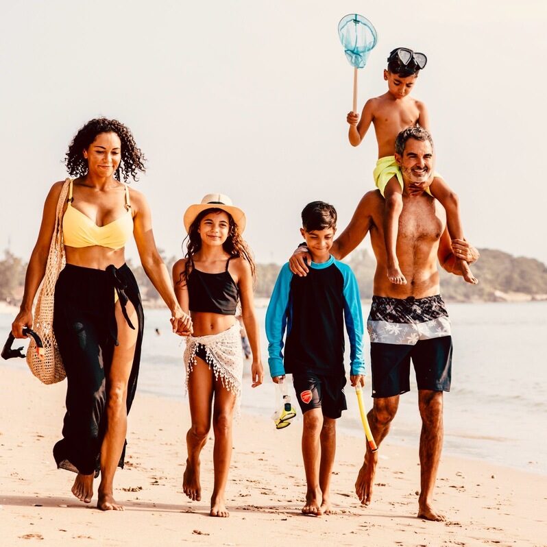 Family of 5 on the beach.